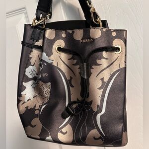 Furla Metallic Floral Drawstring Bucket Bag in Black and Gold